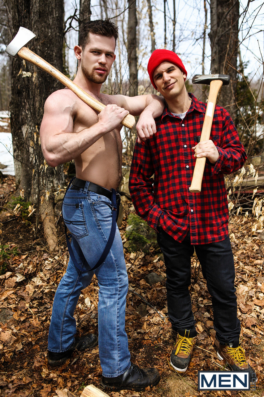 Male lumberjacks take a break from chopping  