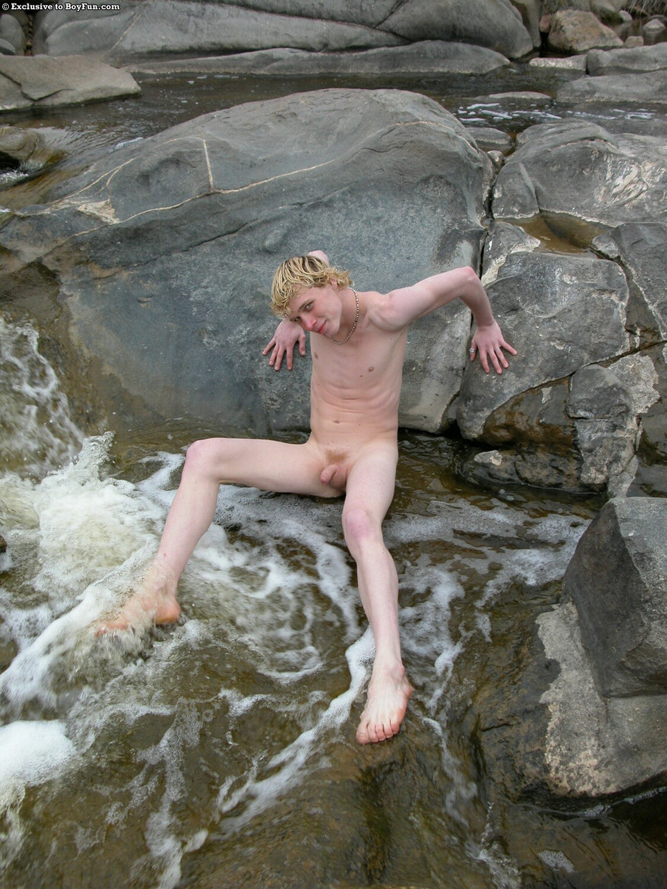 Golden-haired gay hottie Jarrod stripping naked and jerking off by the river  