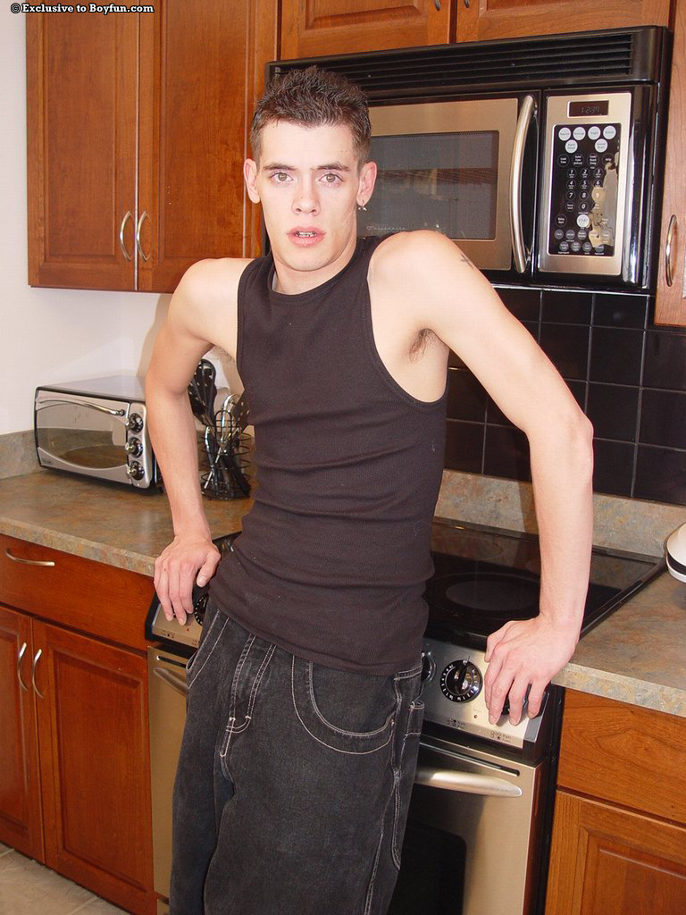 Kinky gay Harold Tigue exposes his slim figure and masturbates in the kitchen  