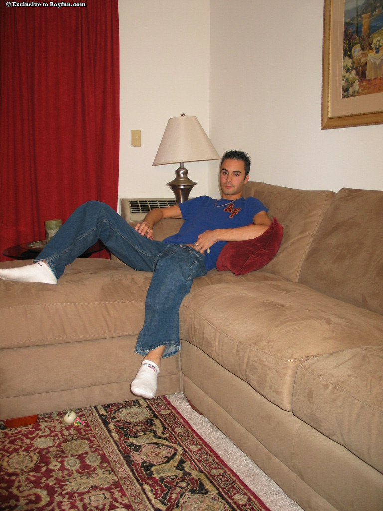 Sexy skinny gay Joey doffs his jeans and masturbates on the couch  